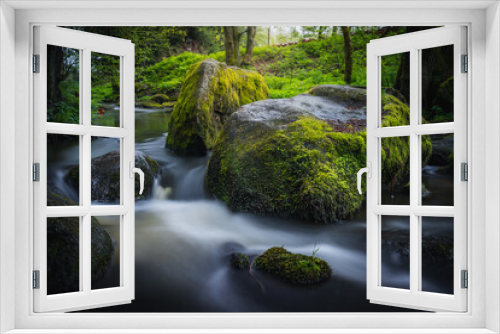 Fototapeta Naklejka Na Ścianę Okno 3D - Green Waterfall River Rocks Covered With Green Moss Forest Waterfall. forest with a waterfall. Quiet and pleasant environment for tourism. Forest area with watercourse in Bavaria Germany