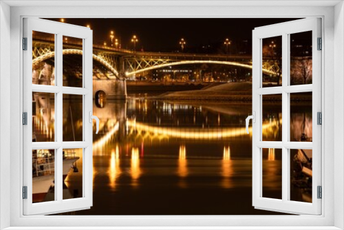 Fototapeta Naklejka Na Ścianę Okno 3D - The Margaret Bridge and its lights as reflected by the Danube river