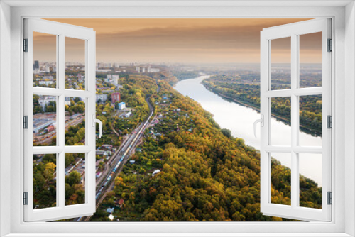 Fototapeta Naklejka Na Ścianę Okno 3D - Aerial view of the picturesque autumn river in the suburbs of an industrial city and the transport railway road