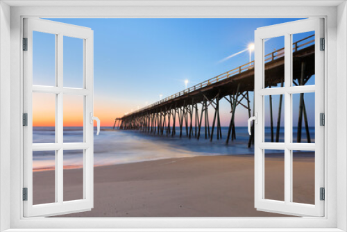Fototapeta Naklejka Na Ścianę Okno 3D - Kure Beach Fishing Pier before sun rise, Kure Beach, North Carolina, USA. 