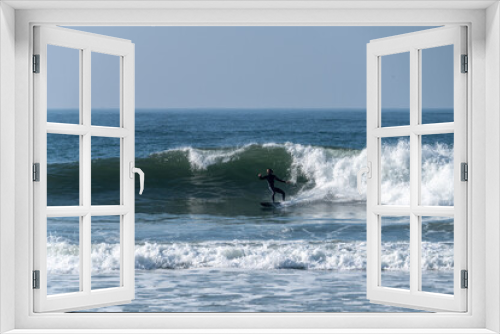 Fototapeta Naklejka Na Ścianę Okno 3D - Surfer riding waves in Furadouro beach