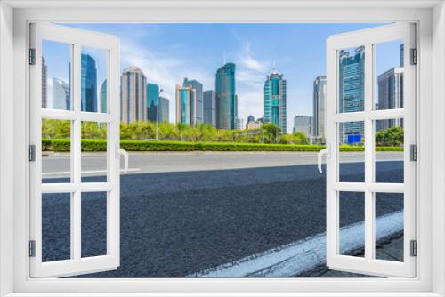 Fototapeta Naklejka Na Ścianę Okno 3D - empty asphalt road with city skyline background in china.