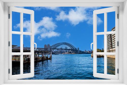 Fototapeta Naklejka Na Ścianę Okno 3D - Sydney Harbour Australia with nice colours in the sky. Nice blue water of the Harbour, high rise offices and residential buildings of the City in the background, NSW Australia