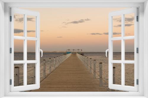 Fototapeta Naklejka Na Ścianę Okno 3D - Wooden pontoon at sea, Golden sea sunset.