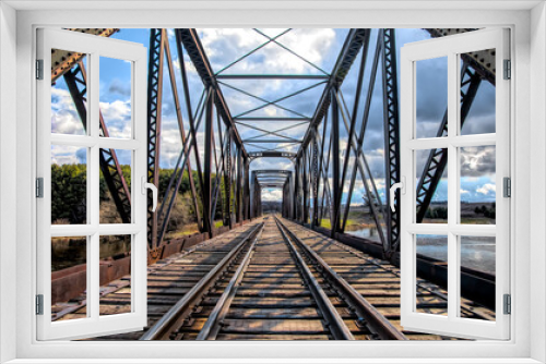 Fototapeta Naklejka Na Ścianę Okno 3D - Old iron railway truss bridge built in 1893 crossing the Mississippi river in spring in Galetta, Ontario, Canada