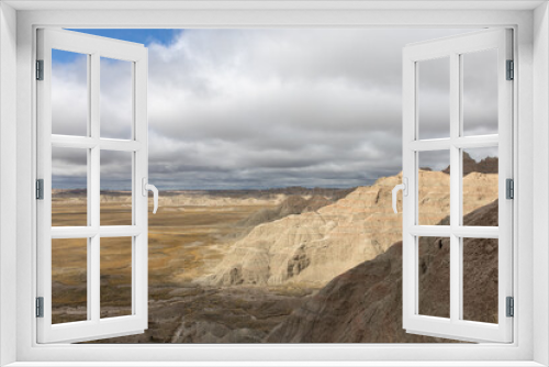 Fototapeta Naklejka Na Ścianę Okno 3D - A dramatic view of the landscape at Badlands National Park in South Dakota