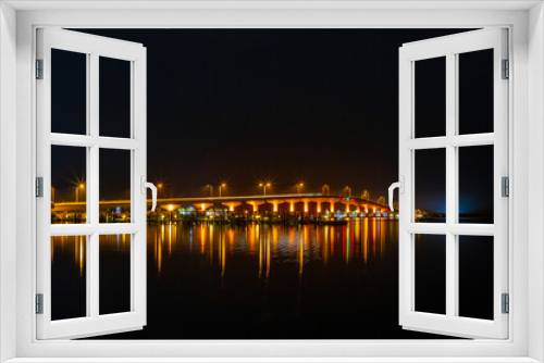 Fototapeta Naklejka Na Ścianę Okno 3D - Bridge over water at night