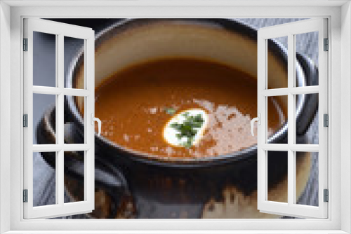 Fototapeta Naklejka Na Ścianę Okno 3D - Spicy tomato soup on a dark cloth