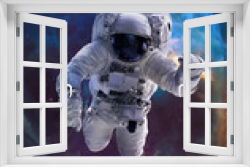 Fototapeta Naklejka Na Ścianę Okno 3D - Astronaut in space. Galaxy and Nebula space art. Vertical 16:9 wallpaper with spaceman. Elements of this image furnished by NASA