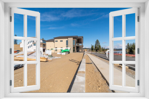 Fototapeta Naklejka Na Ścianę Okno 3D - New luxury waterfront homes under construction along the Spokane River in Coeur d'Alene, Idaho.