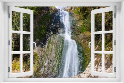 Fototapeta Naklejka Na Ścianę Okno 3D - Beautiful and original panorama. Beautiful and majestic landscape and panorama of a mountain waterfall, a river, in textured and hard rocks and stones in the afternoon in the summer. High quality