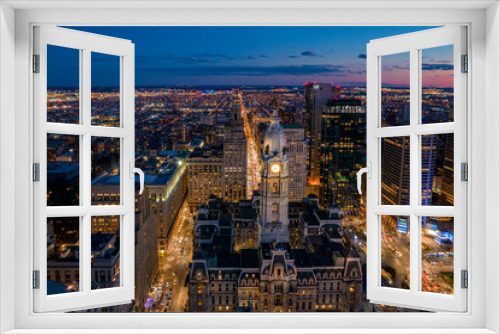 Fototapeta Naklejka Na Ścianę Okno 3D - Aerial Drone View of Philadelphia Skyline at Sunset with Glowing City Lights with Town Hall in Foreground 