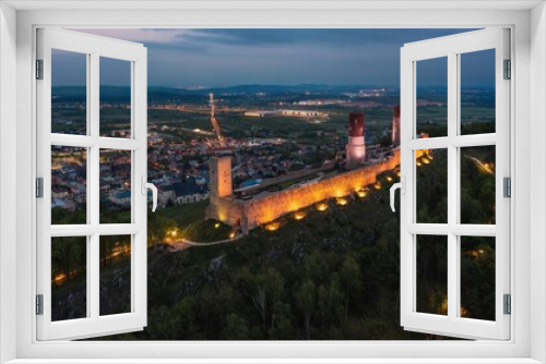 Fototapeta Naklejka Na Ścianę Okno 3D - Aerial drone night view over the colorful, illuminated Chęciny Castle (Kielce County, Świętokrzyskie Voivodeship) in Poland 