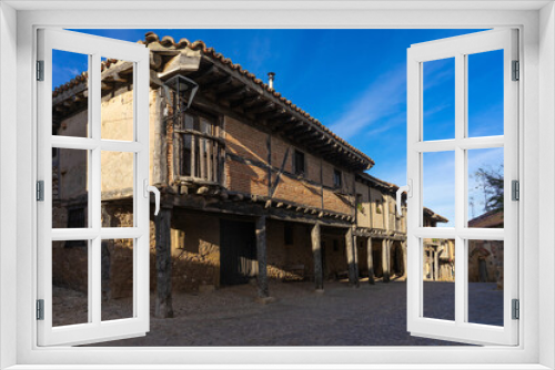 Fototapeta Naklejka Na Ścianę Okno 3D - View of the traditional houses of the medieval village of Calatañazor in a sunny day, Soria, Castilla y Leon, Spain.