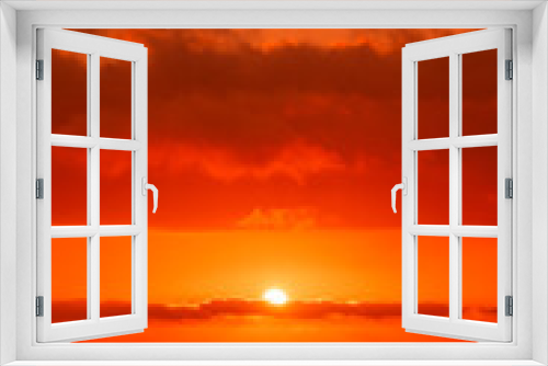 Fototapeta Naklejka Na Ścianę Okno 3D - Red sun in the clouds. Great dramatic view. Amazing sky panorama. Colorful sunset in the evening sky. Clouds illuminated by the setting sun. Meditative calmness and greatness