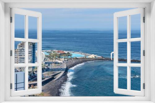 Fototapeta Naklejka Na Ścianę Okno 3D - Views from Mirador de la Paz towards the charming town featuring hotels, a black sand beach and the water park Lago Martianez, Puerto de la Cruz, Tenerife, Canary Islands, Spain