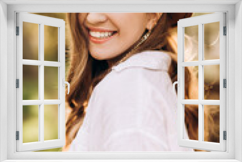 Fototapeta Naklejka Na Ścianę Okno 3D -  Cute portrait of a girl with a smile with closed eyes in nature. The girl is happy to fly. Happiness and warmth. Concentration of love and kindness in the world.