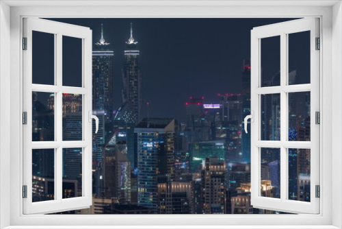 Fototapeta Naklejka Na Ścianę Okno 3D - Skyline with modern architecture of Dubai business bay towers night timelapse. Aerial view
