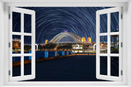 Fototapeta Naklejka Na Ścianę Okno 3D - Star trails in the sky over Sydney Harbour NSW Australia startrails. lovely patterns and beautiful colours of the night.