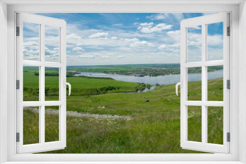 Fototapeta Naklejka Na Ścianę Okno 3D - Sunny view on panorama of the Volga river. landscape with green hills and a river
