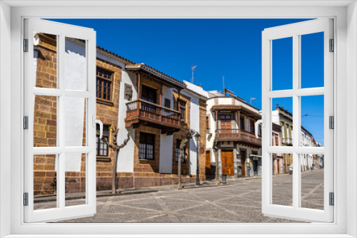 Fototapeta Naklejka Na Ścianę Okno 3D - Teror at Gran Canaria, Spain. A beautiful traditional town with colorful houses with wooden balconies