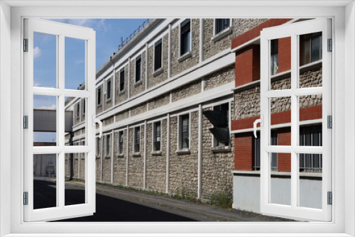 Fototapeta Naklejka Na Ścianę Okno 3D - Anciennes usines et ancien siège de l'entreprise Leroy Somer, vue de l'extérieur, ville de Angoulême, département de la Charente, France