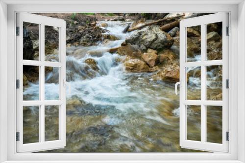 Fototapeta Naklejka Na Ścianę Okno 3D - Cascade of waterfalls among stones. Fluffy water. Spring landscape. Falling water.