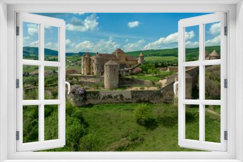 Fototapeta Naklejka Na Ścianę Okno 3D - Aerial view of imposing castle of Berze Le Chatel in Burgundy with 14 towers and three enclosures in Central France dominating the valley below