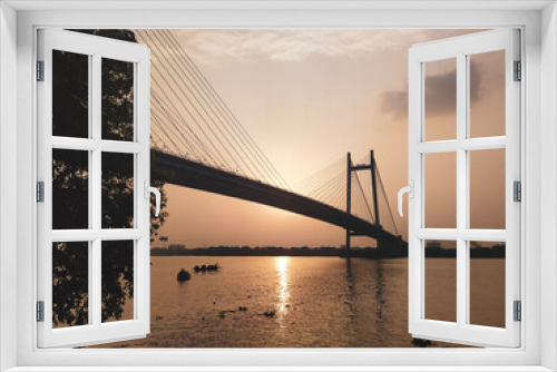 Fototapeta Naklejka Na Ścianę Okno 3D - HOOGHLY BRIDGE KOLKATA AT SUNSET