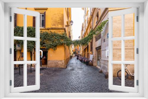 Fototapeta Naklejka Na Ścianę Okno 3D - Narrow street with cafe and small shops in Rome. Italy travel concept, visiting cozy places