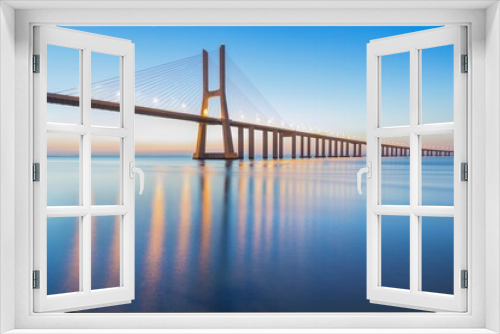 Fototapeta Naklejka Na Ścianę Okno 3D - Background on the Lisbon bridge. The Vasco da Gama Bridge is a landmark, and one of the longest bridges in the world. Urban landscape. Portugal is an amazing tourist destination
