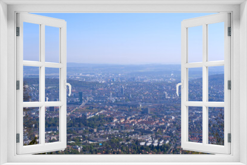 Aerial view over City of Zürich on a beautiful spring day with blue cloudy sky background. Photo taken April 21st, 2022, Zurich, Switzerland.