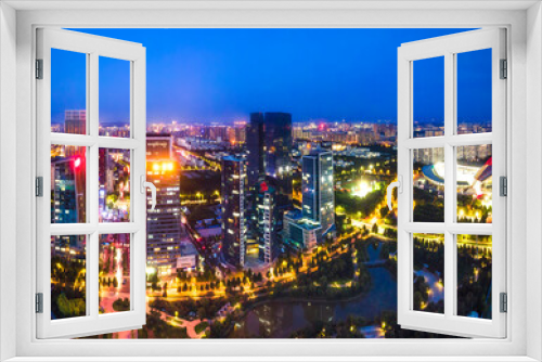 Fototapeta Naklejka Na Ścianę Okno 3D - Night view of modern urban architecture landscape in Zibo, China