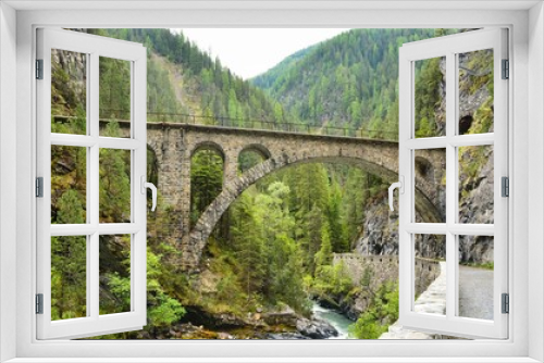Fototapeta Naklejka Na Ścianę Okno 3D - Viaduct in Davos Monstein. Landwasser river flows through the canyon. hike along the river in the valley to filisur. Old