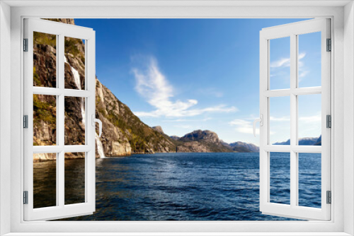 Fototapeta Naklejka Na Ścianę Okno 3D - View of Norwegian waterfall cascading into Lysefjorden fjord