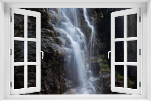 Fototapeta Naklejka Na Ścianę Okno 3D - view of waterfall pouring through cliffs