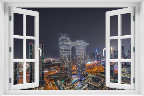 Fototapeta Naklejka Na Ścianę Okno 3D - Futuristic Dubai Downtown and finansial district skyline aerial night timelapse.