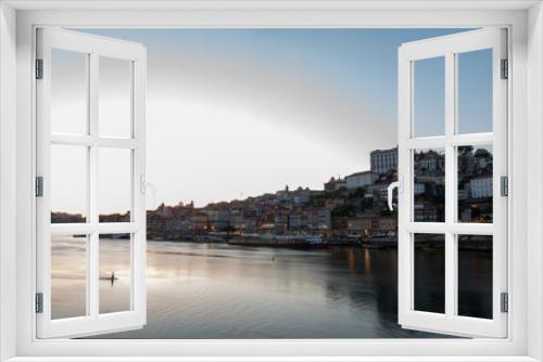 Fototapeta Naklejka Na Ścianę Okno 3D - Cityscape of Porto over the Douro Luis II river in Porto, Portugal in Summer 2022.