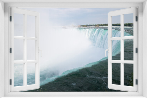 Fototapeta Naklejka Na Ścianę Okno 3D - Dramatic Horseshoe at Niagara Falls seen from the Canadian side.