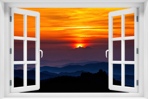 Scenic view of mountains against sky during sunrise