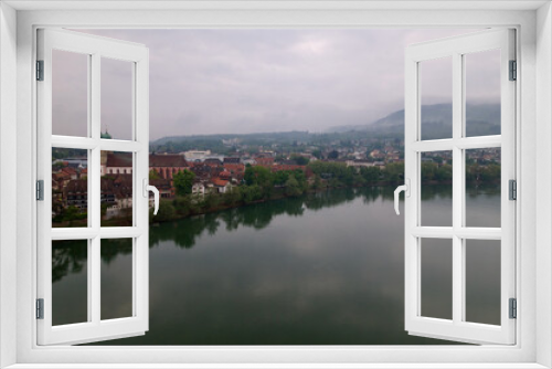 Fototapeta Naklejka Na Ścianę Okno 3D - City of Bad Säckingen, Baden-Württemberg, with church and Rhine River on a cloudy spring day. Photo taken May 6th, 2022, Stein, Switzerland.