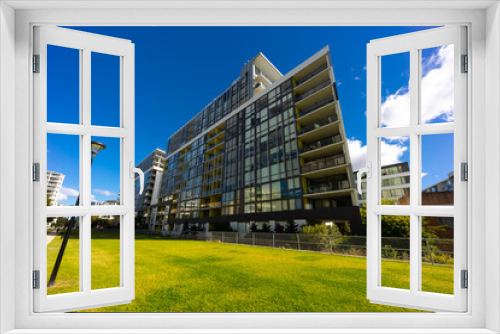 Fototapeta Naklejka Na Ścianę Okno 3D - Residential high rise apartment building in inner Sydney suburb NSW Australia. Residential complex in leafy suburbia. Urban living high density suburban city 
