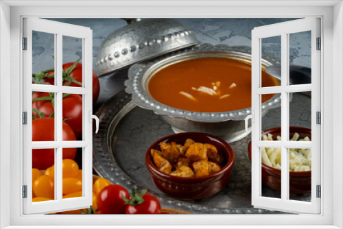 Fototapeta Naklejka Na Ścianę Okno 3D - Bowl with tomato soup and ingredients, tomata soup in a metal bowl served with cheeese and croutons and different color of fresh  tomatoes