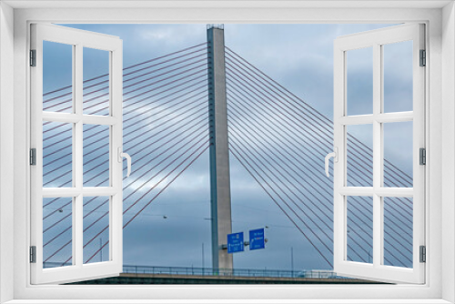 Fototapeta Naklejka Na Ścianę Okno 3D - A modern bridge spans the Rhine River near Cologne, Germany.