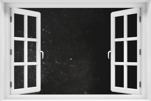 Fototapeta Naklejka Na Ścianę Okno 3D - Dust particles float in neutral light on black background