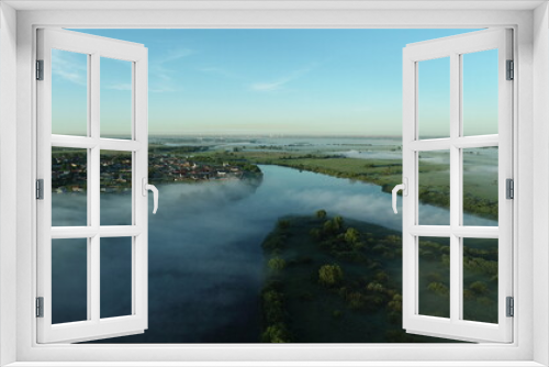 Fototapeta Naklejka Na Ścianę Okno 3D - Bird's eye view of the mist over the river and meadows on an early summer morning