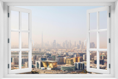 Fototapeta Naklejka Na Ścianę Okno 3D - Dubai's skyscrapers and top view on a sunny day