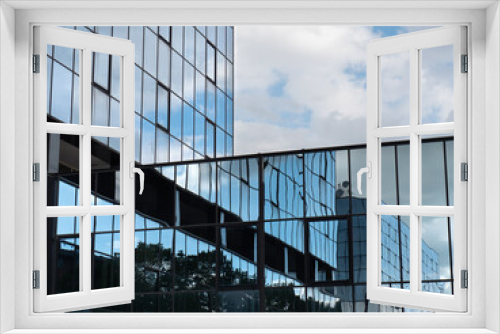 Fototapeta Naklejka Na Ścianę Okno 3D - Modern Building Glass Facade Reflecting Cloudy Blue Sky