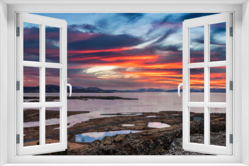 Fototapeta Naklejka Na Ścianę Okno 3D - Idyllic view of beautiful lakes and landscape during sunset. Scenic view of land and stream in valley against cloudy sky. Picturesque scenery in northern Alpine region.
