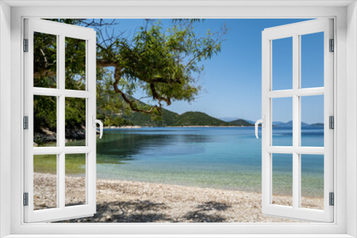 Fototapeta Naklejka Na Ścianę Okno 3D - A pristine beach with crystal clear calm water on Ithaca Island, Greece.